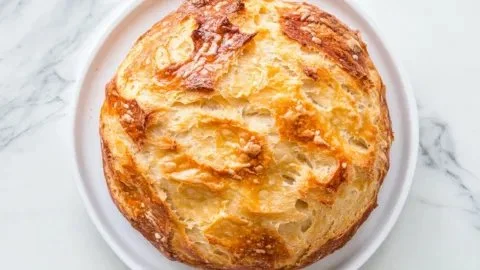 Freshly baked no knead Dutch oven bread with a crispy crust