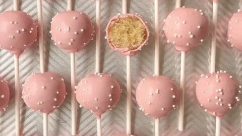 Starbucks copycat birthday cake pops with colorful sprinkles on a white plate.