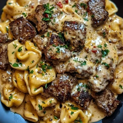 Creamy steak and tortellini skillet featuring tender steak slices and pasta