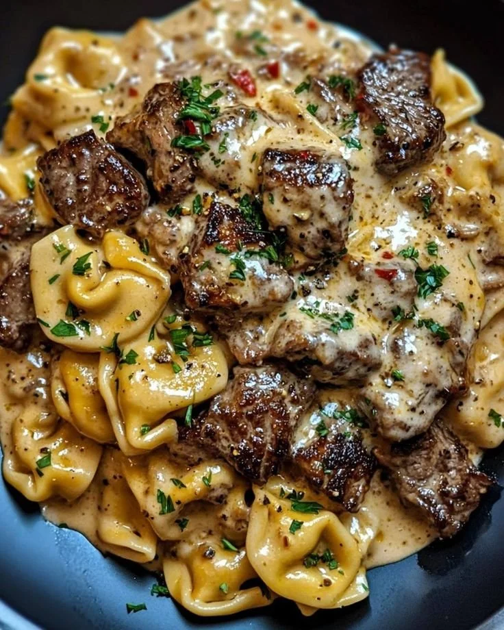 Creamy steak and tortellini skillet featuring tender steak slices and pasta