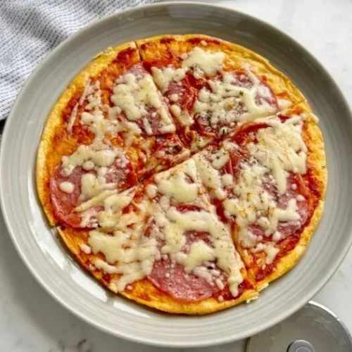 Delicious Pizza Eggs topped with cheese, tomatoes, and herbs