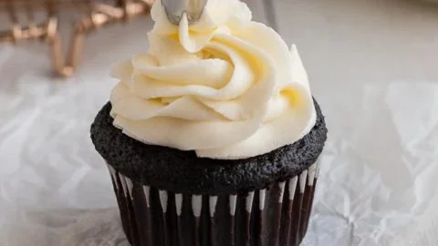 Vanilla American Buttercream Frosting in a bowl with a spatula