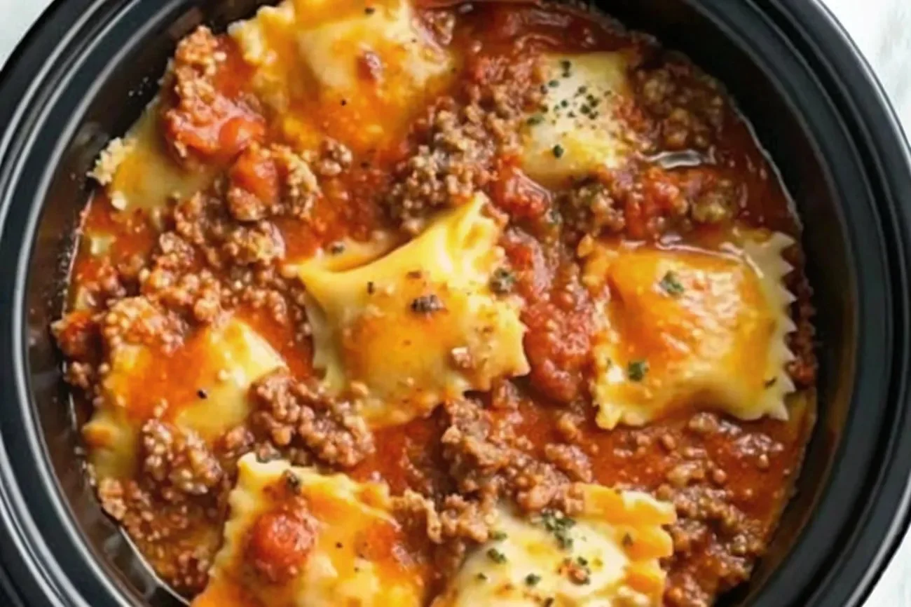 A steaming serving of Crockpot Ravioli Lasagna filled with cheese and sauce.