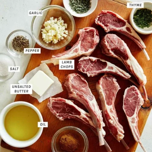 Succulent Garlic Butter Lamb Chops garnished with herbs on a plate