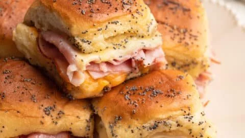 Baked ham and cheese sliders served on a platter