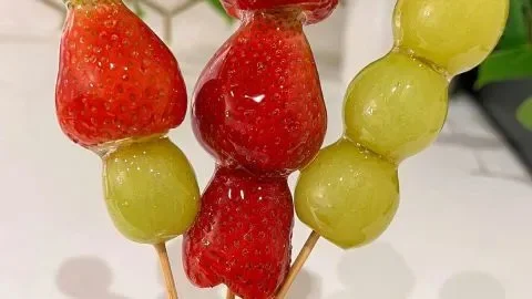 Homemade Tanghulu - Chinese candied fruit recipe with vibrant berries and sugar glaze.