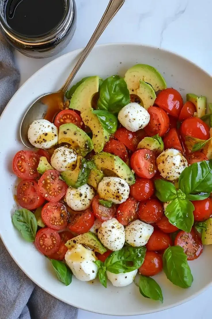 Light Avocado Caprese Salad with fresh tomatoes, mozzarella, and basil