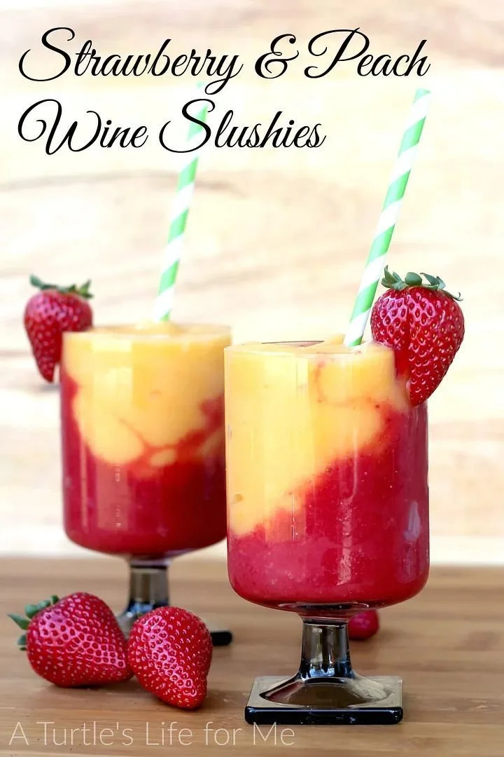 Strawberry and Peach Wine Slushies in a glass with fresh fruit garnish